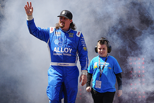 CHoR patient Frankie Ferreira walking with NASCAR driver Josh Williams