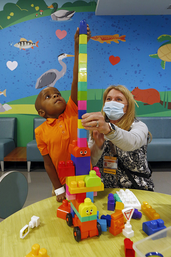CHoR patient Wesley building a block tower in clinic
