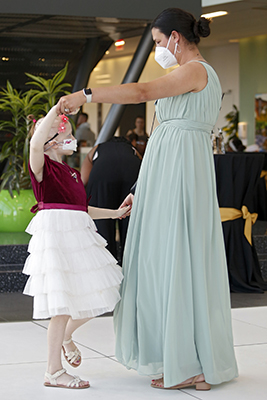 Volunteer and patient dance at CHoR oncology prom
