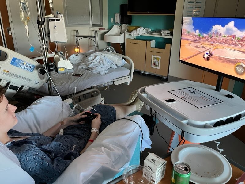CHoR patient Rocky playing video games while he recovers from surgery