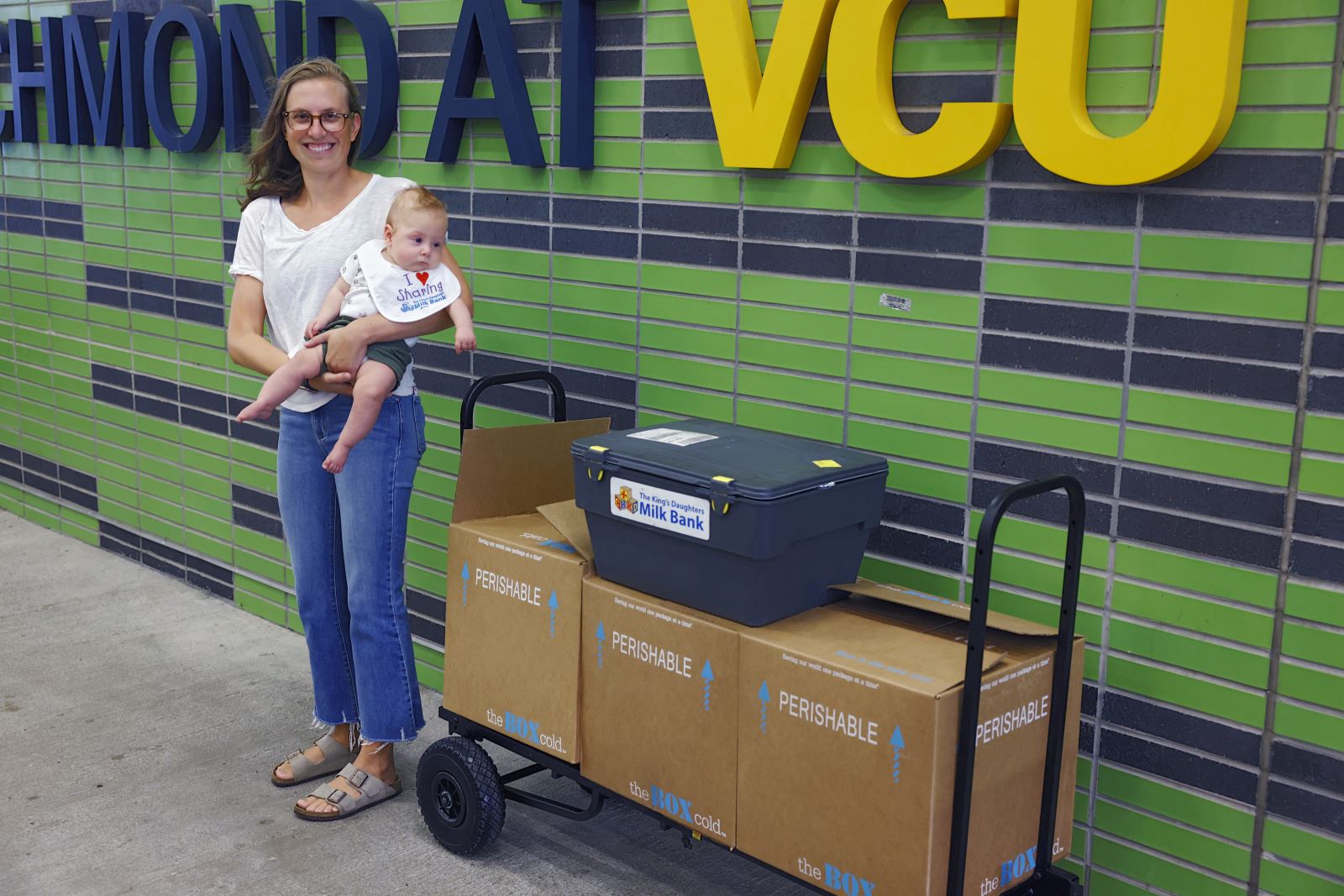 DeLanie LeTard and Baby Barrett show off her donations at breast milk drive