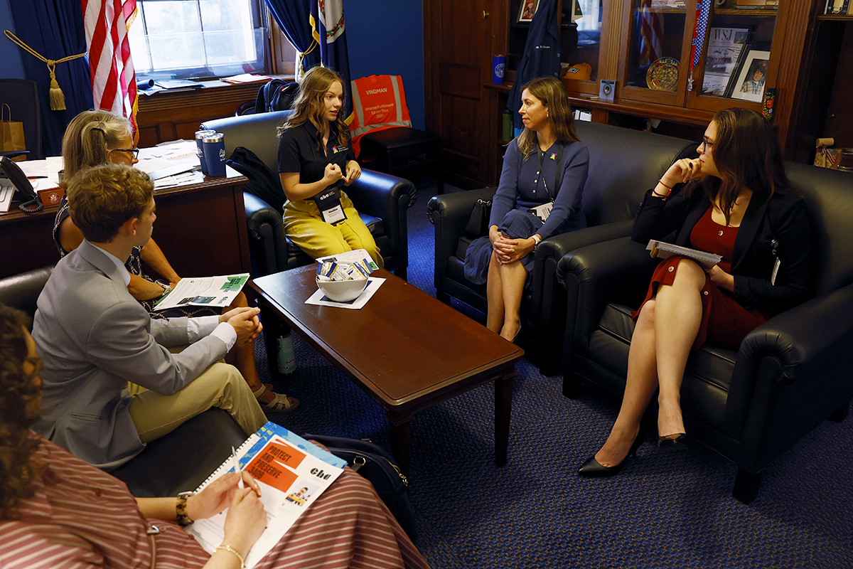CHoR patient Riley speaks with a lawmaker in their Congressional office