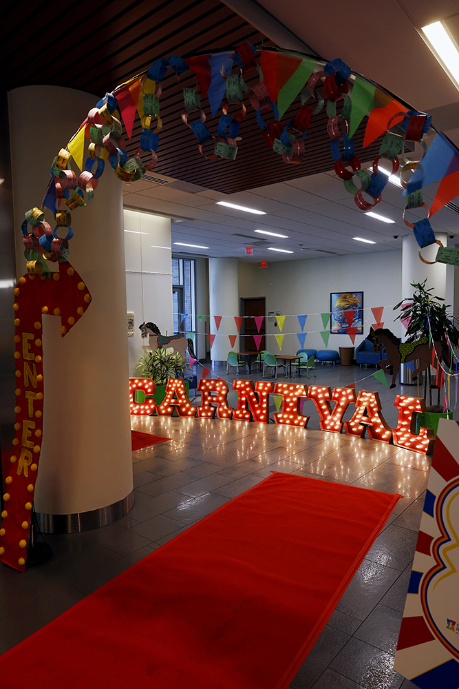 CHoR prom entrance with carnival spelled in lit letters