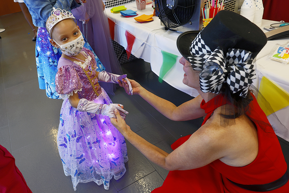CHoR's Robyn Dillon holds hands with a patient attending prom