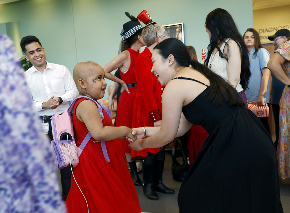 A CHoR nurse dances with a patient at the hematology oncology prom