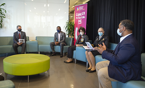 Becerra, far left, speaks with Richmond, HHS and VCU Health leaders, including Mayor Levar Stoney (second from left)