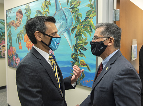 VCU President Michael Rao speaks with U.S. Secretary of Health and Human Services Xavier Becerra during his visit to Children's Hospital of Richmond at VCU