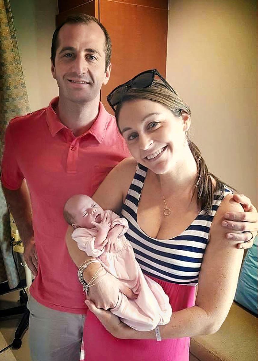 Baby Aubrey with her parents leaving the hospital