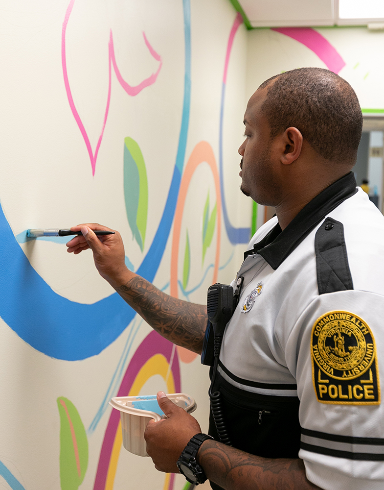 VCU Police Officer painting CHoR mural