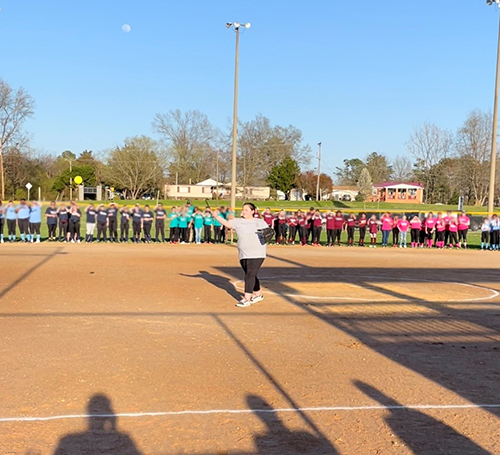Carmela, trauma patient at CHoR, throwing her first pitch