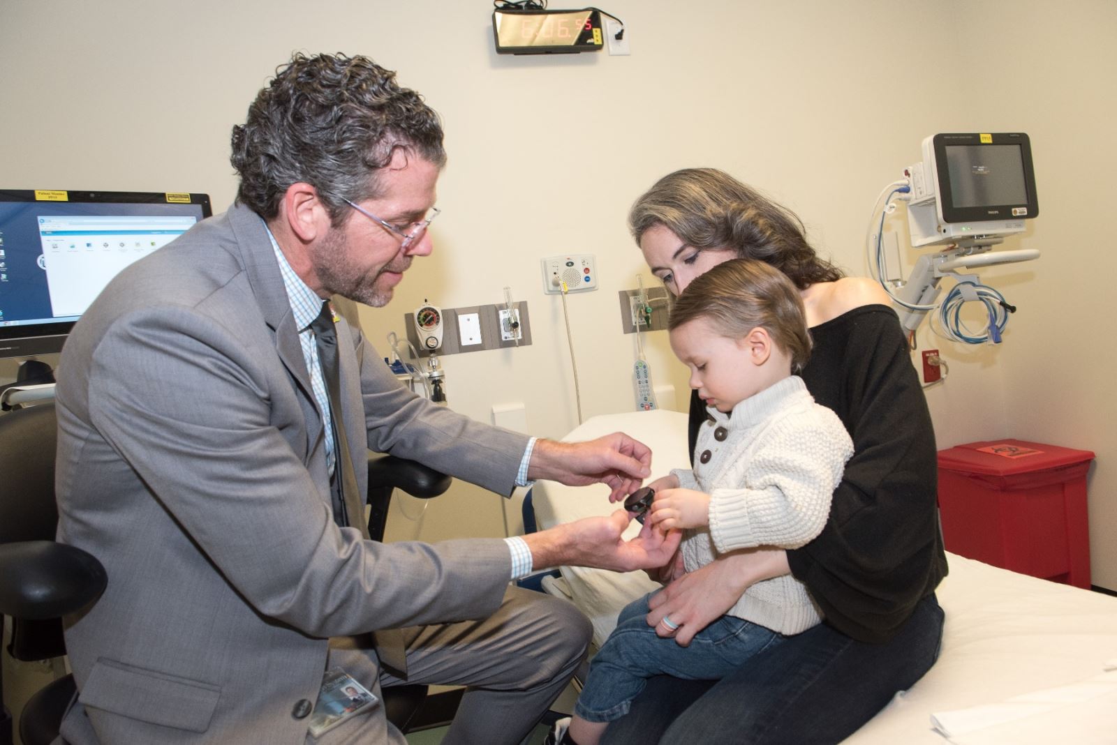 Obadiah with doctor and mom for patient visit