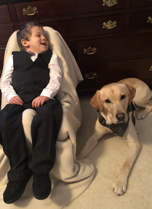 CHoR patient Eli and his service dog Koda