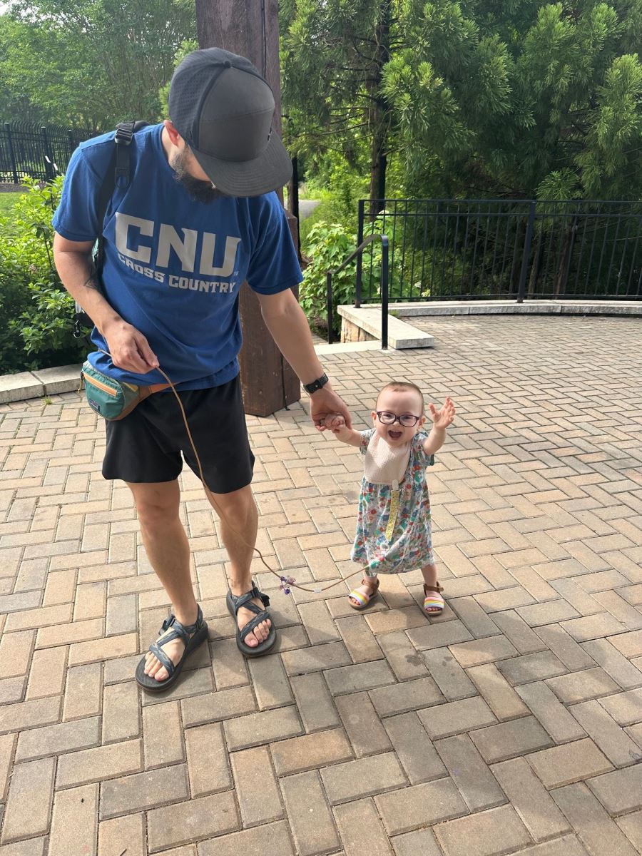 Baby Ellie walks with her dad Will Zak