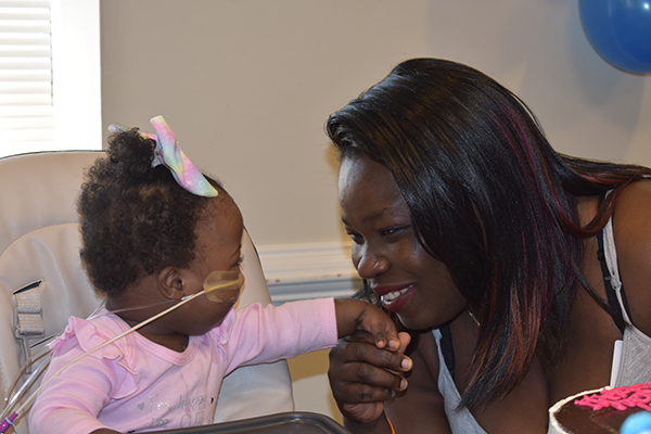 Ephah, mom, and Jahziah, heart care center patient
