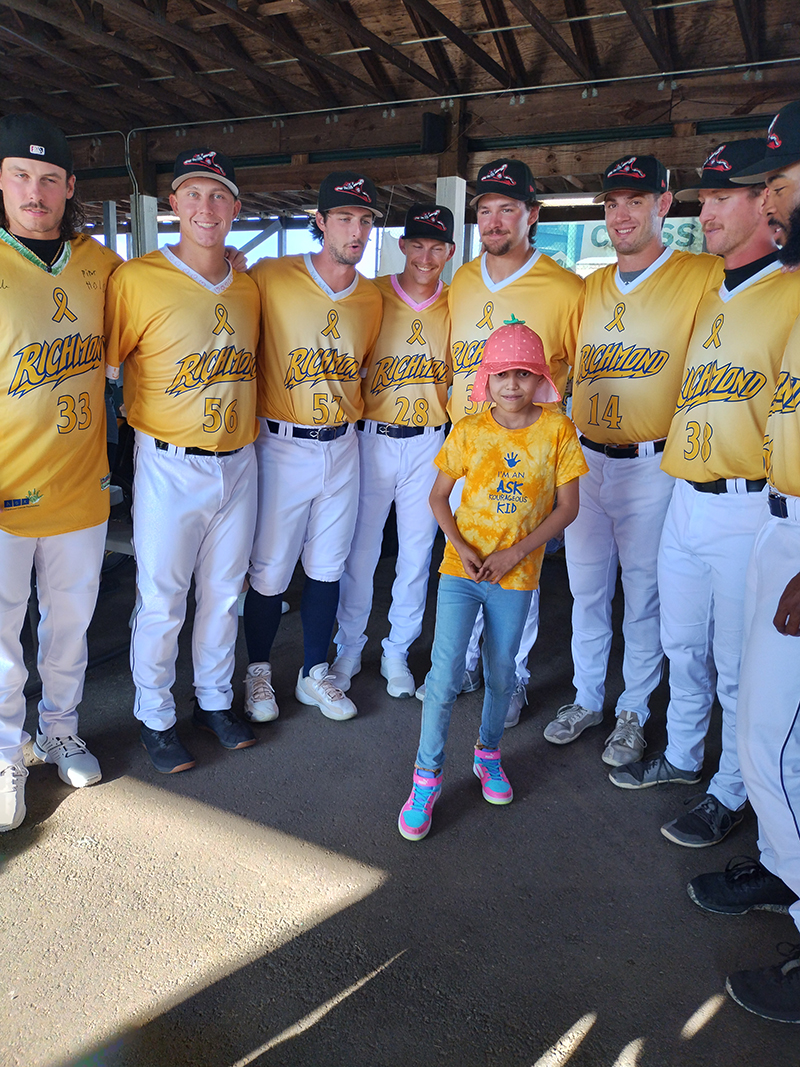 CHoR patient Estrella with the Richmond Flying Squirrels all in yellow