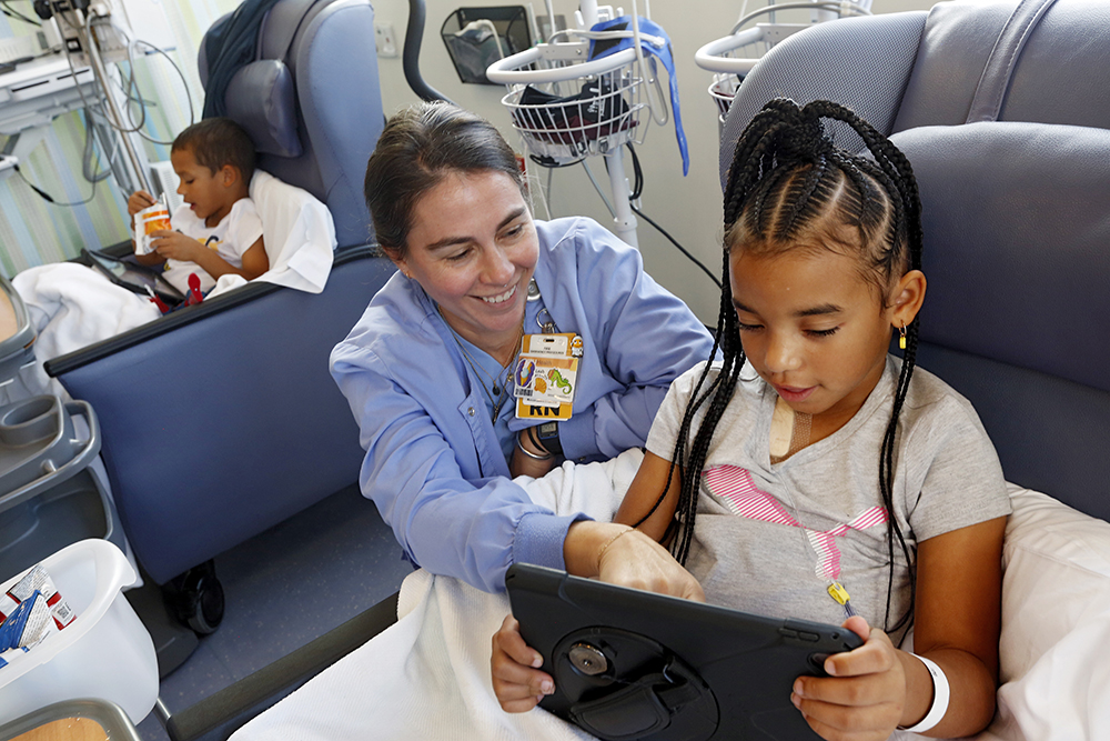 Leah and Evan getting an infusion at the Children's Pavilion