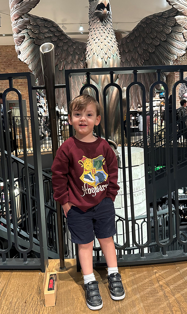 CHoR NICU grad George in a Harry Potter sweatshirt