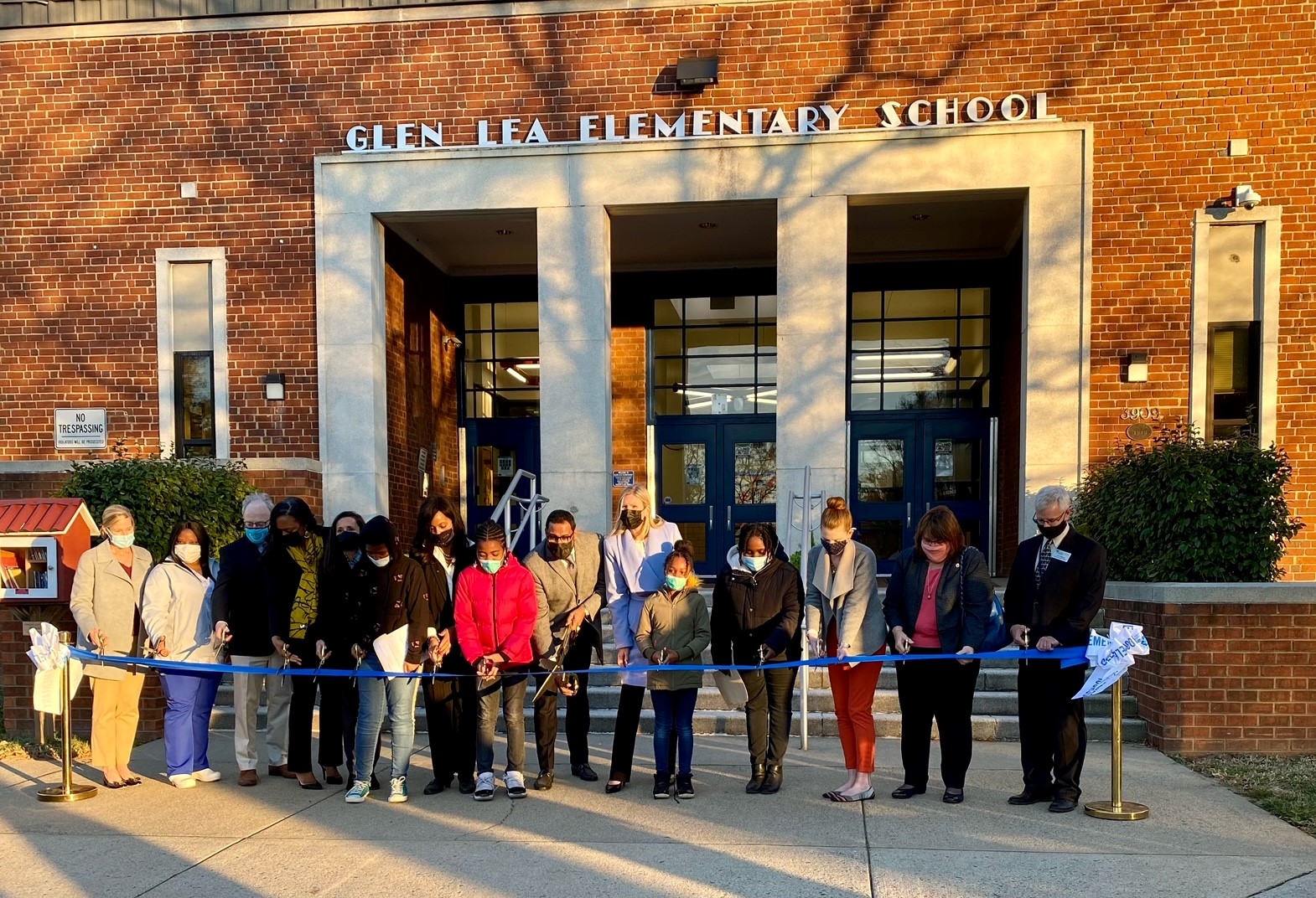 Ribbon cutting for virtual health clinic in front of Glen Lea Elementary School