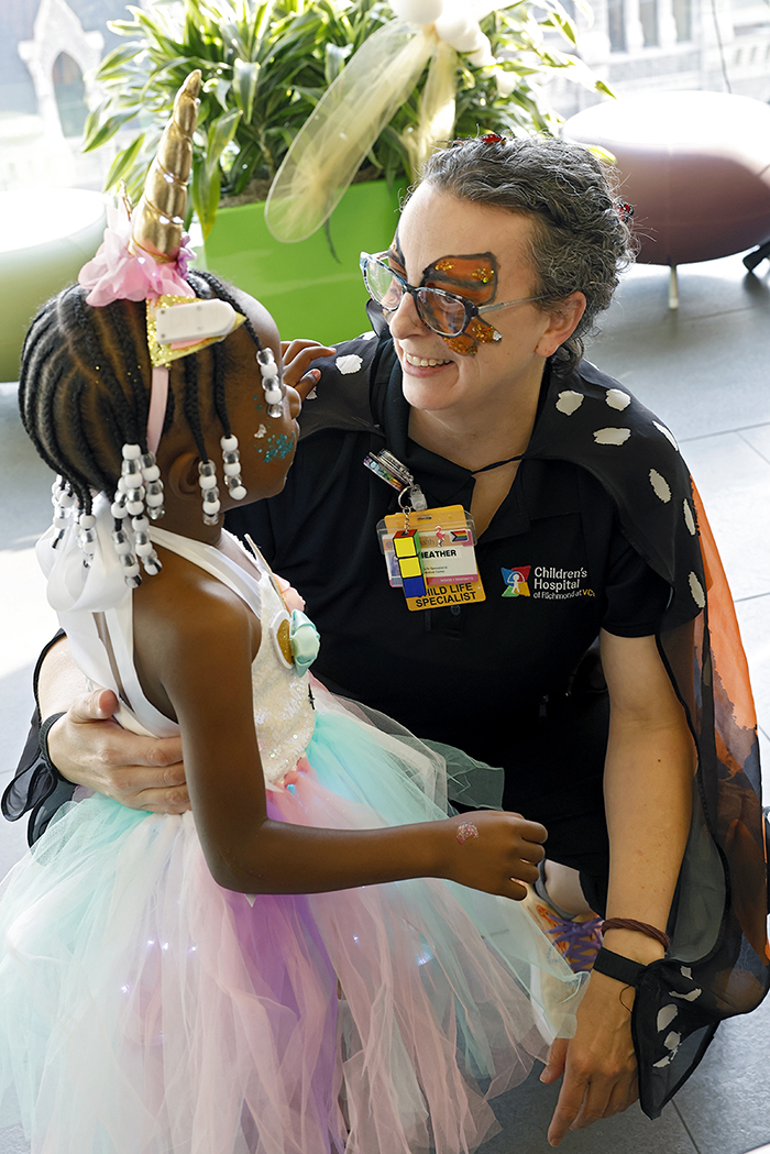 CHoR child life specialist Heather Rossi interacts with a young patient at the oncology prom