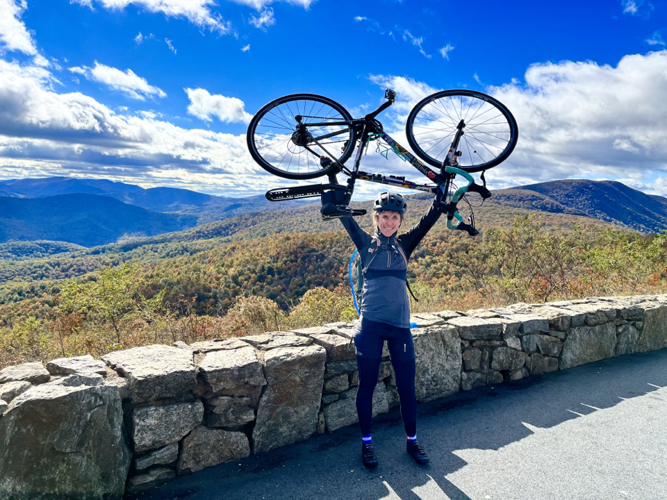 CHoR doctor Hannah Hollon with her bike in the mountains