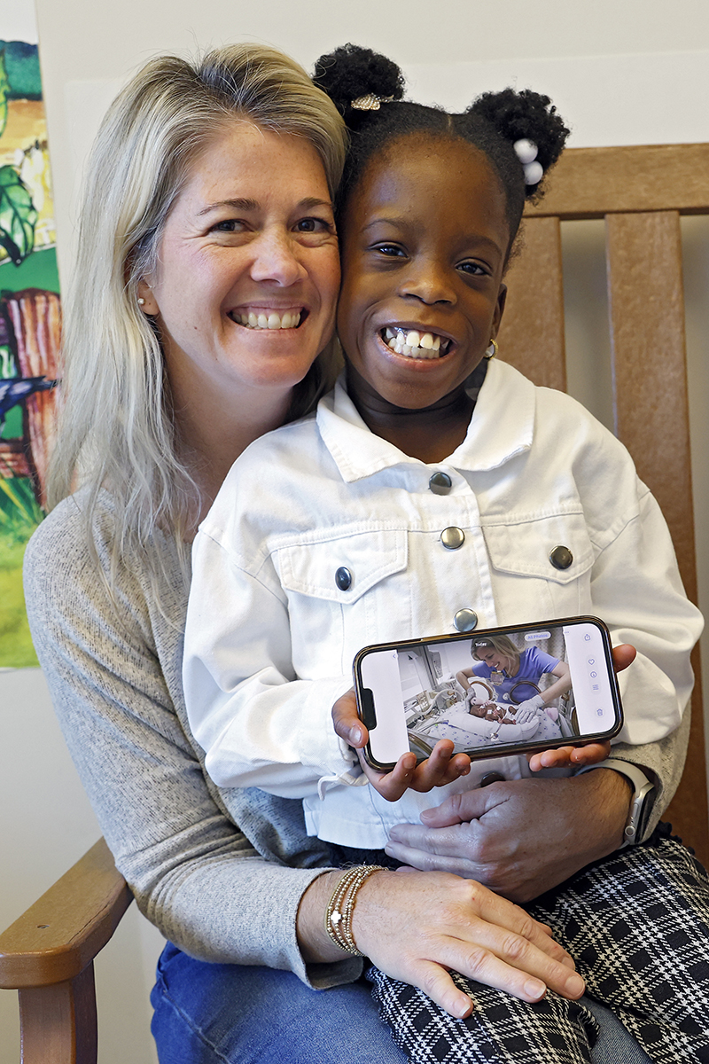 CHoR NICU nurse Jamie Burton with the sextuplet she cared for 8 years ago