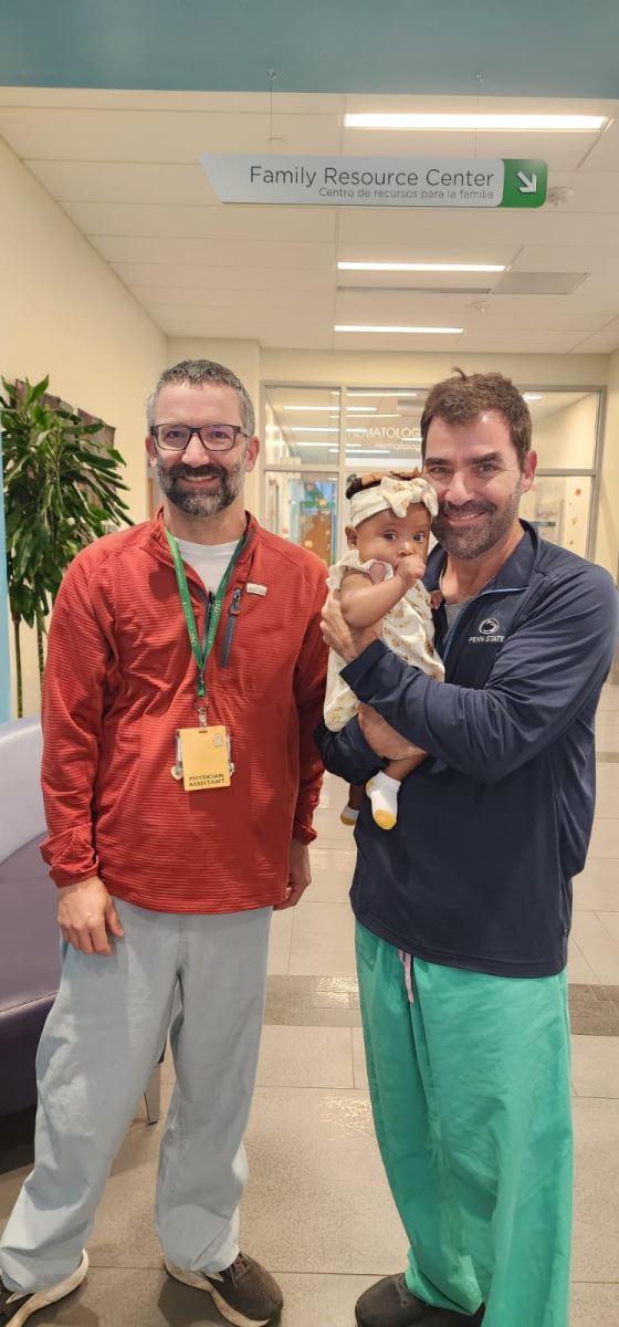 Kahlea with Dr. Brian Kogon and PA Hugh Cline in the Children's Pavilion lobby