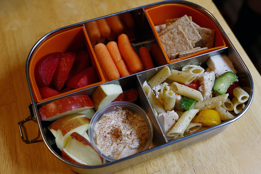 Lunchbox with pasta salad and fruit and veggies