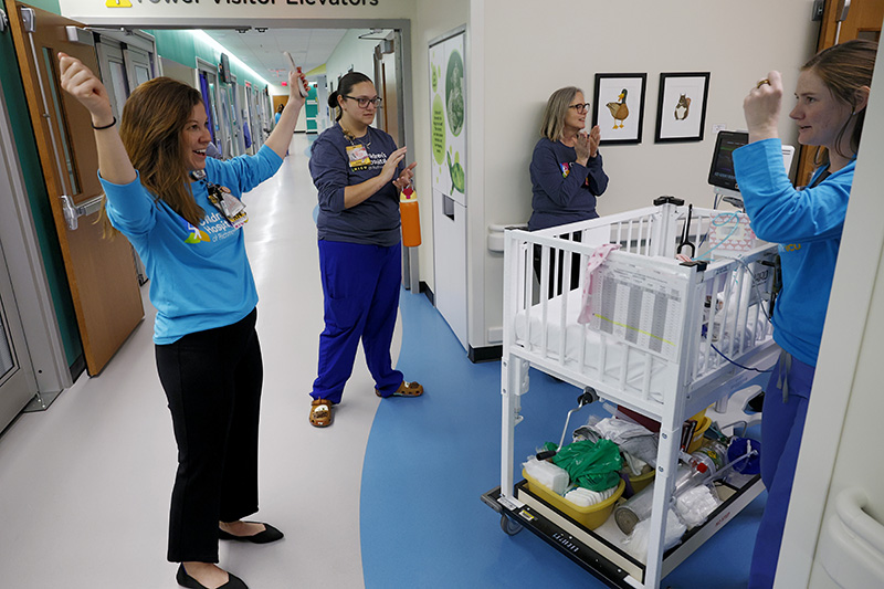 NICU nurses cheering for a successful move to the Children's Tower
