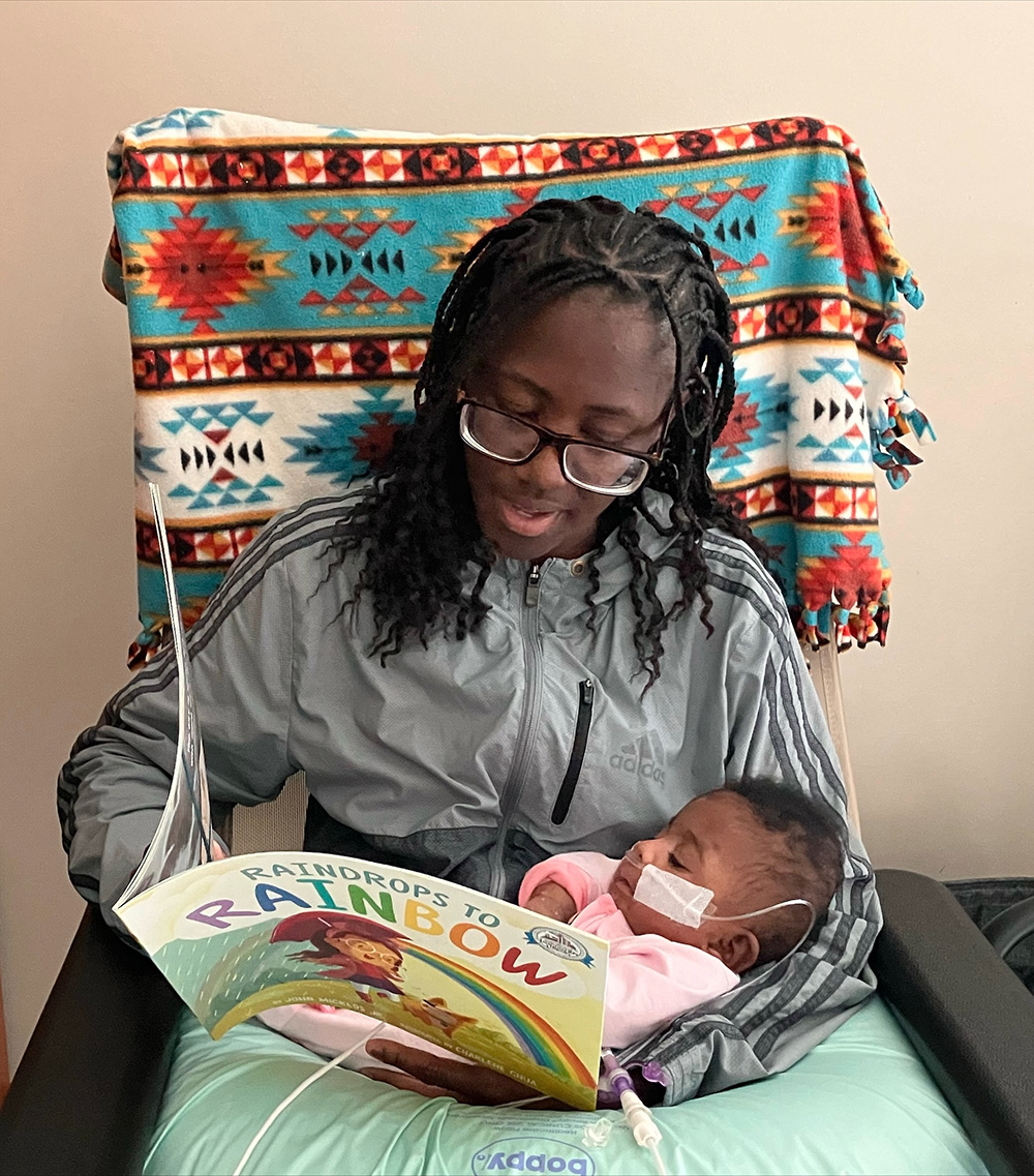 Mom reading to her baby in the CHoR NICU