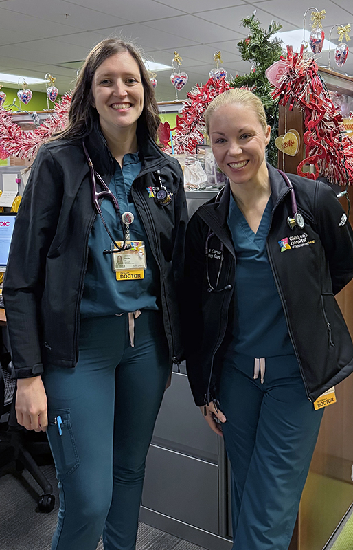 Dr. Jordan Noble and Dr. Kerri Carter in matching scrubs at CHoR