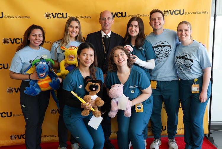 VCU dental students pose with the dean at Give Kids a Smile