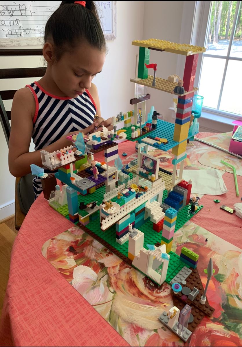 CHoR kid Tatiana building with Legos