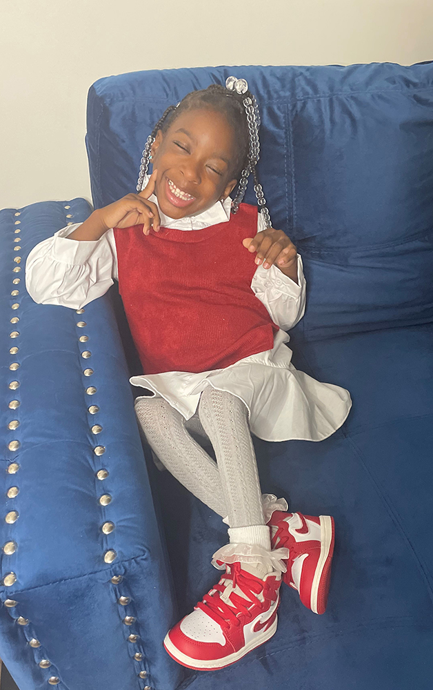 CHoR Calendar Kid Triniti smiling in her school clothes