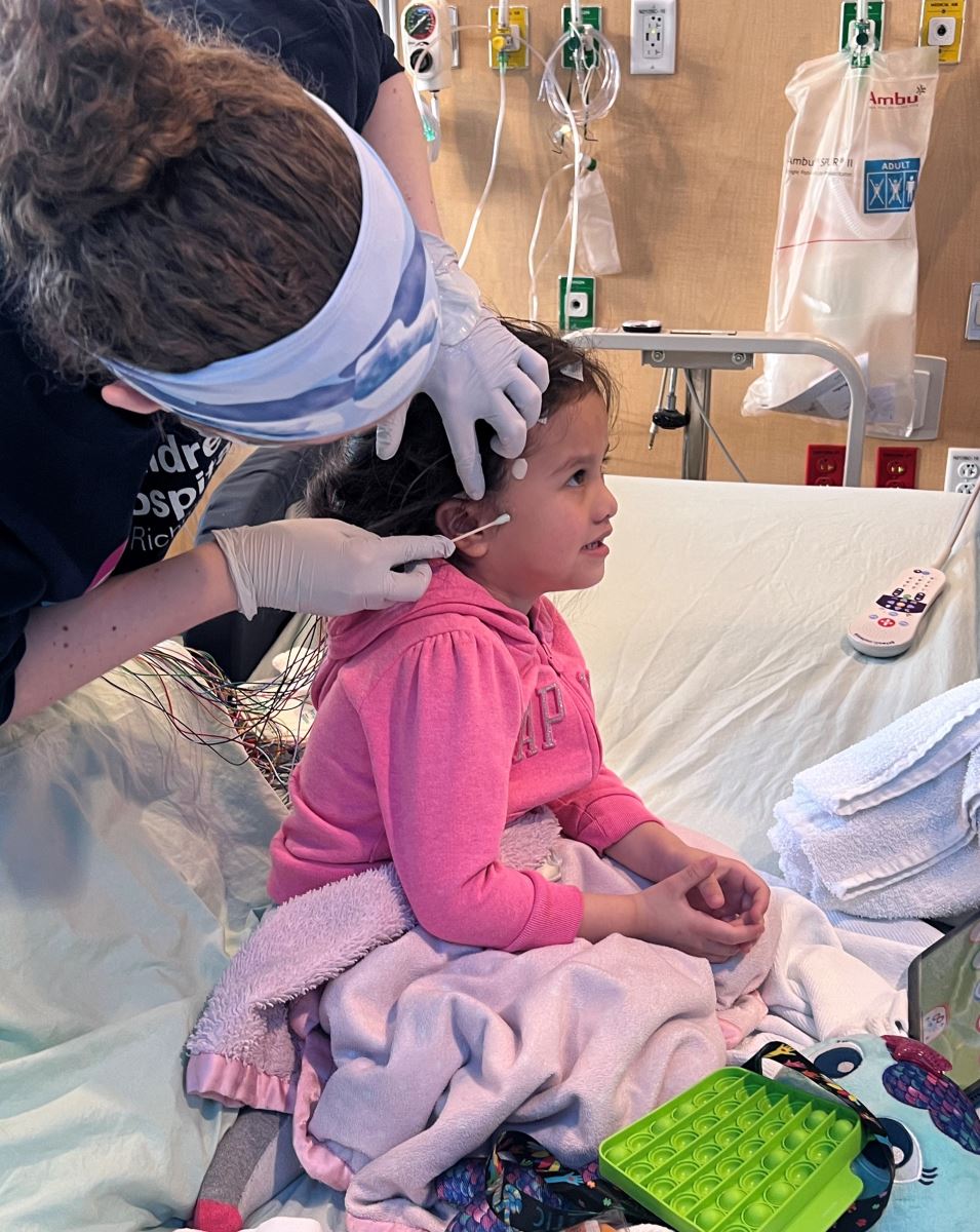 CHoR patient Victoria getting ready for her EEG in the epilepsy monitoring unit