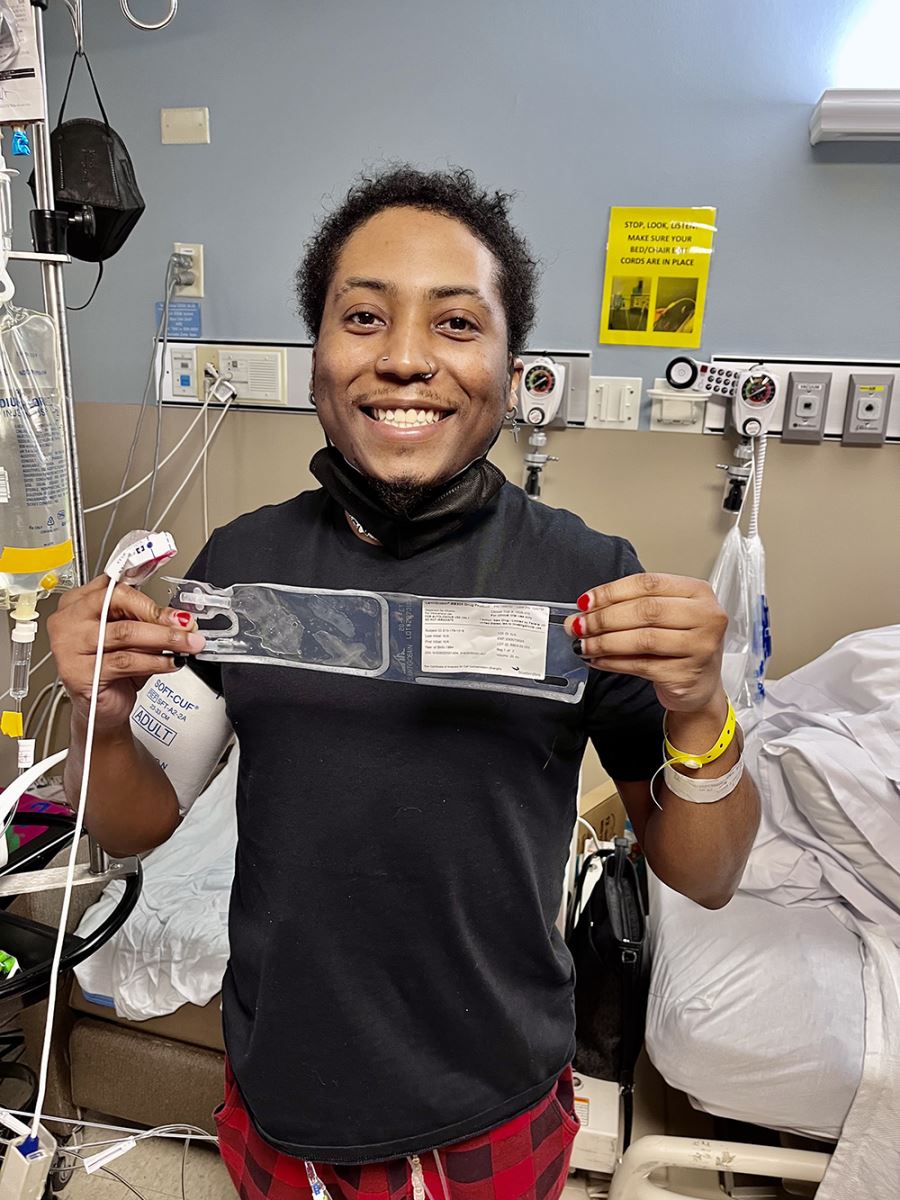 CHoR patient Walter Davis smiling and standing in his hospital room