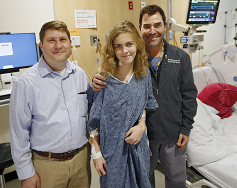 CHoR heart patient Emma with her congenital heart surgeon and cardiologist