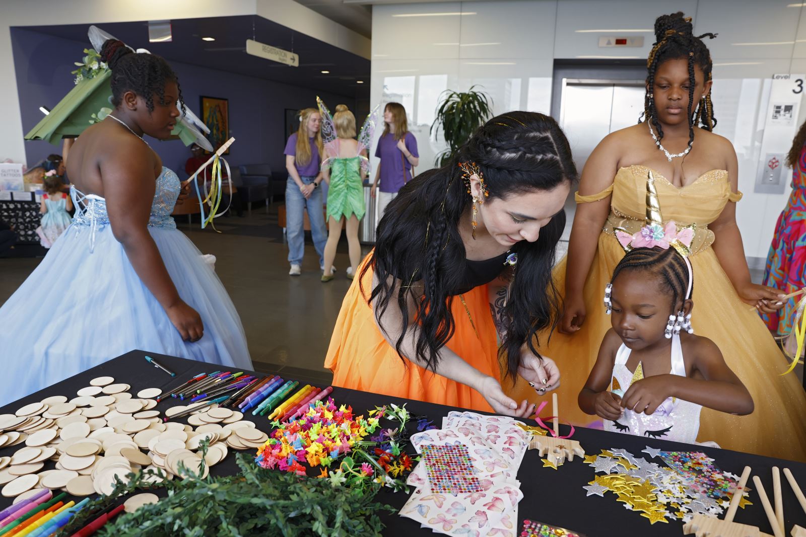 Attendees build their own fairy wands at the oncology prom