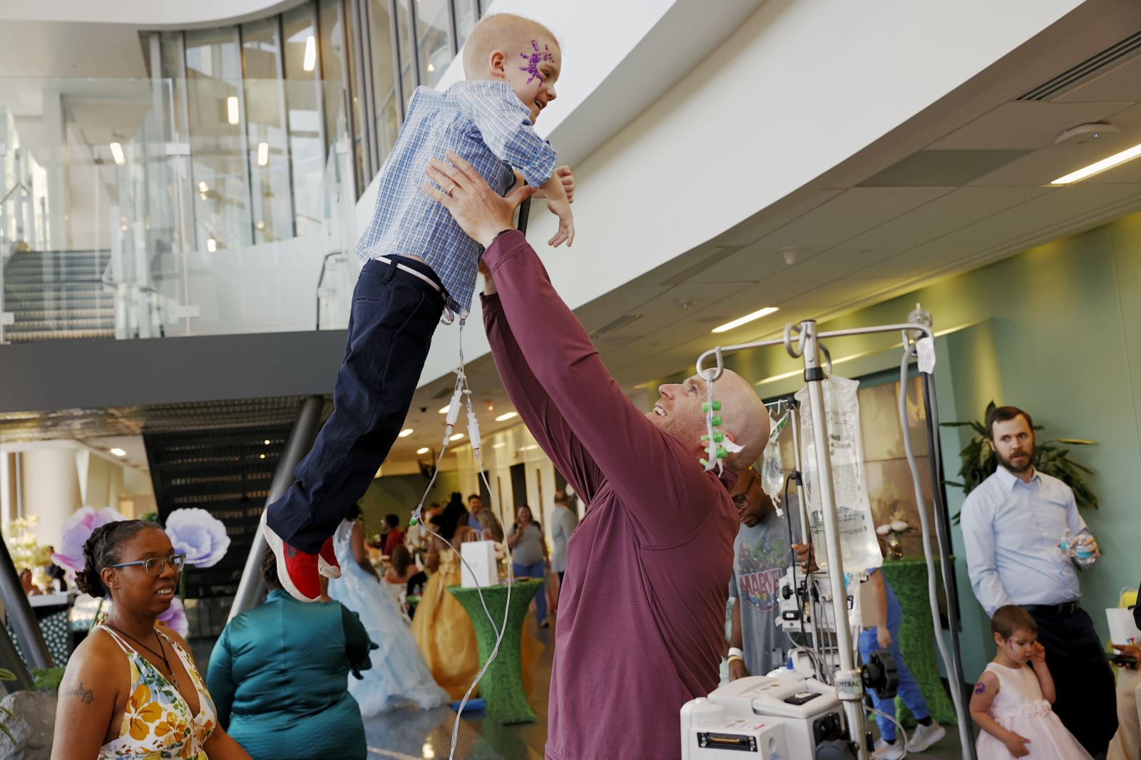 Father and son show off their dance moves at the 2025 oncology prom