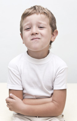 child suffering from stomach pain